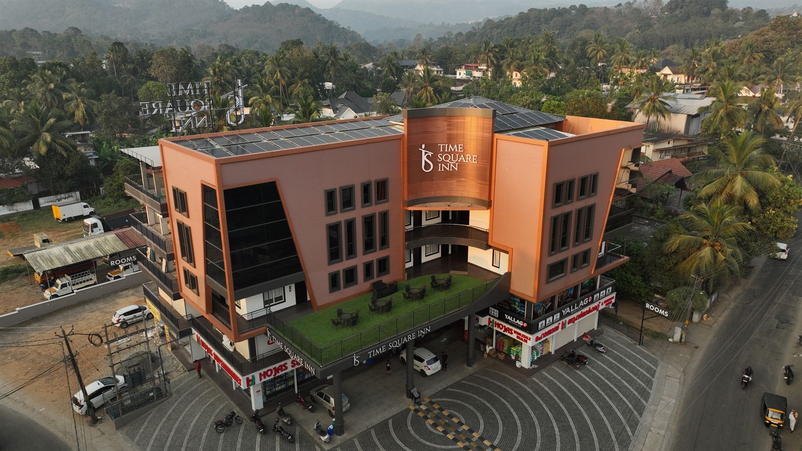 Front view of Time Square Inn hotel building in Erattupetta